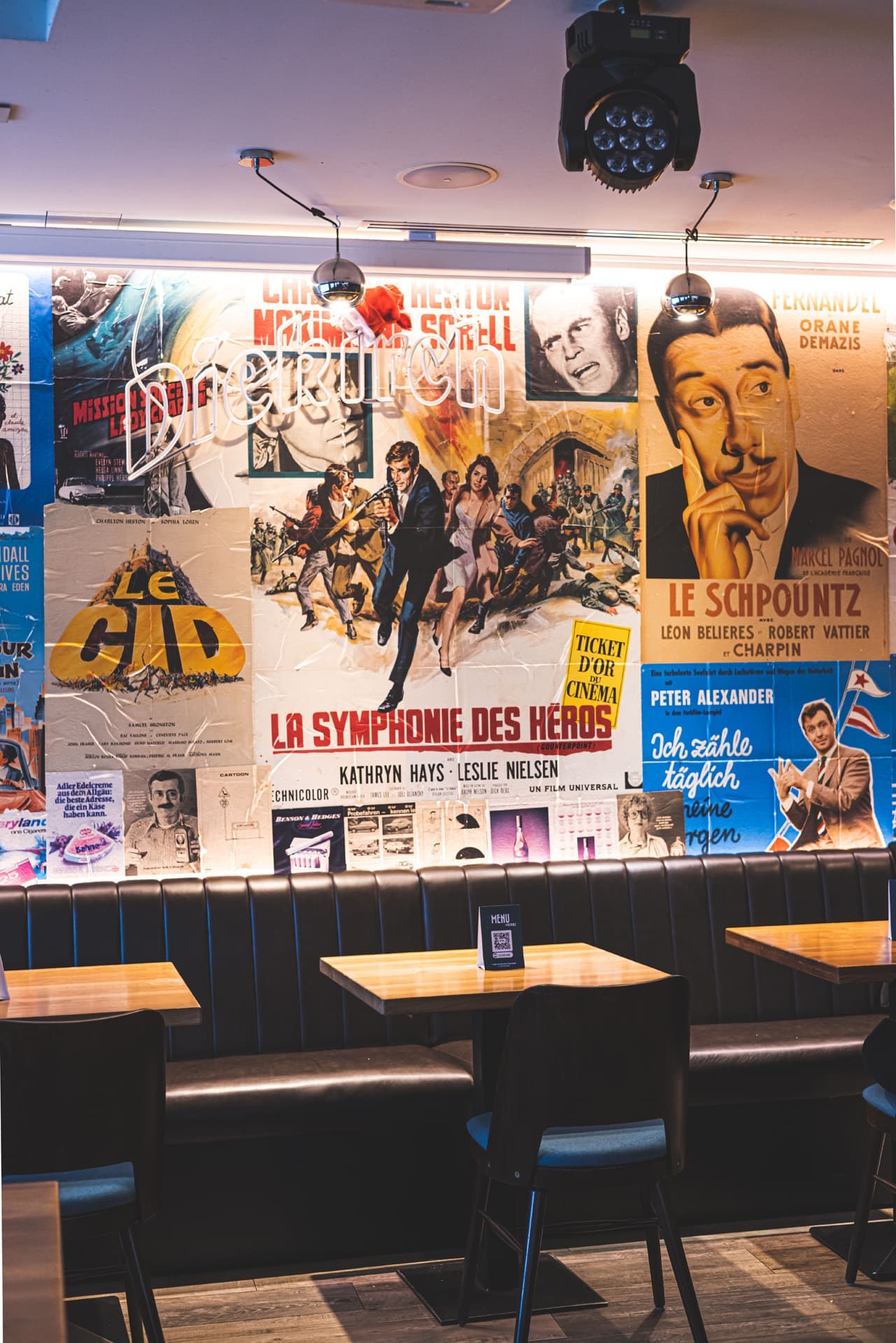 Interior table and wall covered by posters